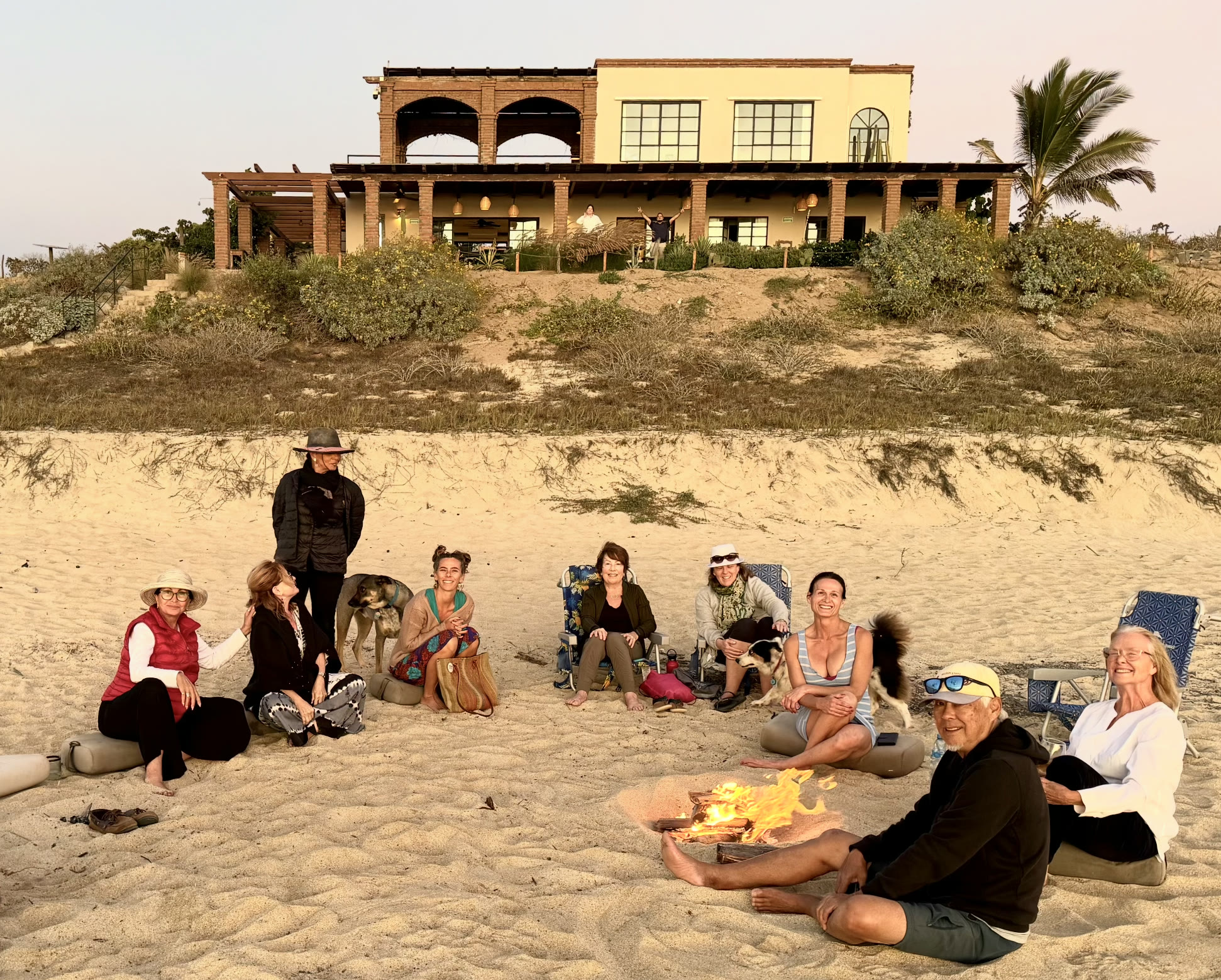 Ron Nakamoto with a group gathered around a fire in Mexico